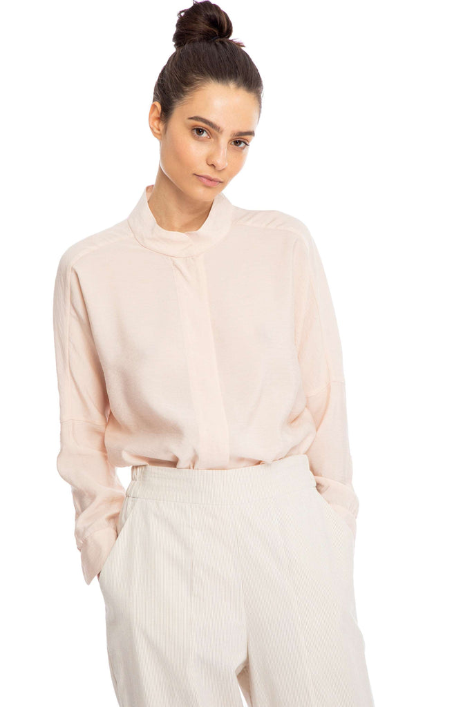 NINObrand Anson Blush Over sized button down Dropped long sleeve Viscose fabric Wash at or below 30°C. Do not Bleach. Do not Tumble Dry. Iron, Medium temp. Dry clean, any solvent except Trichloroethylene.