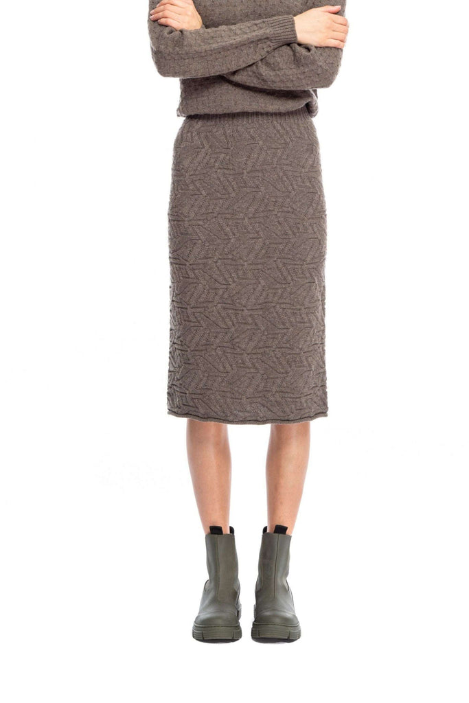 NINObrand Sun Knit Skirt Knitted high waist pencil skirt Escher (stitch) has contrasting textures interlock in a playful take on the artist’s dynamic geometric designs; a nuanced trick of the eye is captured in this luxe fabric. 8gg 100% Italian merino Knitted in Brooklyn Dry clean only