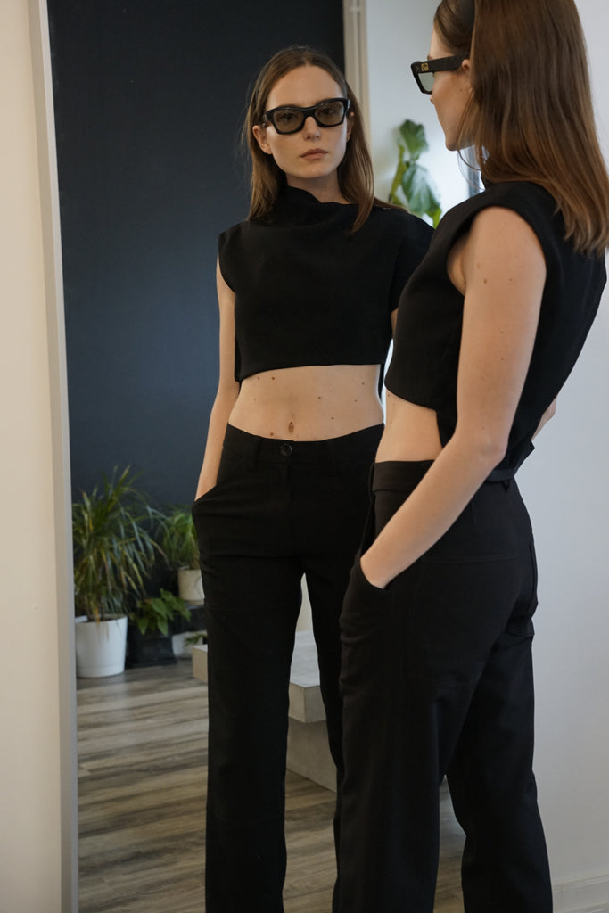 Modern black blouse with architectural asymmetrical silhouette