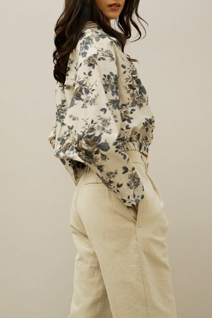 Lightweight cotton-silk wrap blouse with navy floral print, featuring a structured collar and effortless drape – sustainable designer clothing.