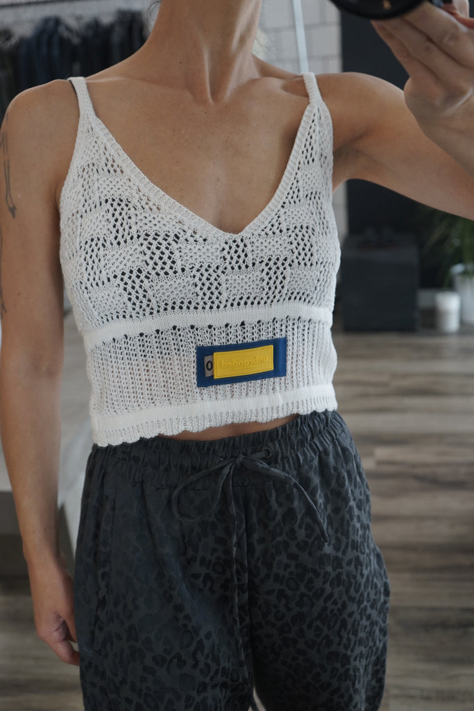 Front photo of the white loose knit tank top by Unbranded