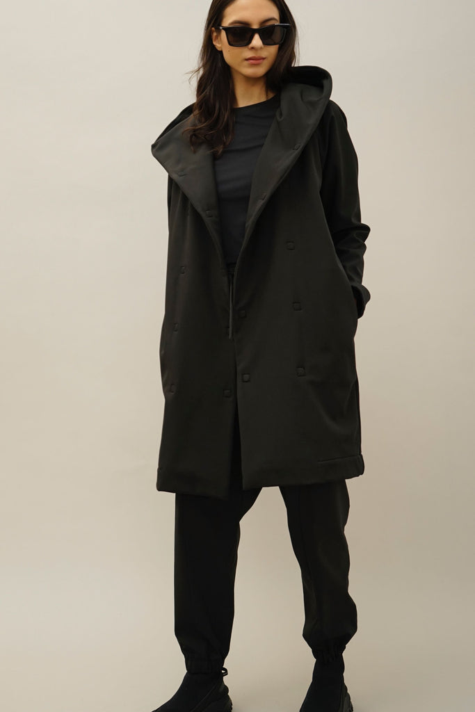 Stylish black technical jacket with a fleece-lined interior, ideal for hiking, camping, and casual wear.