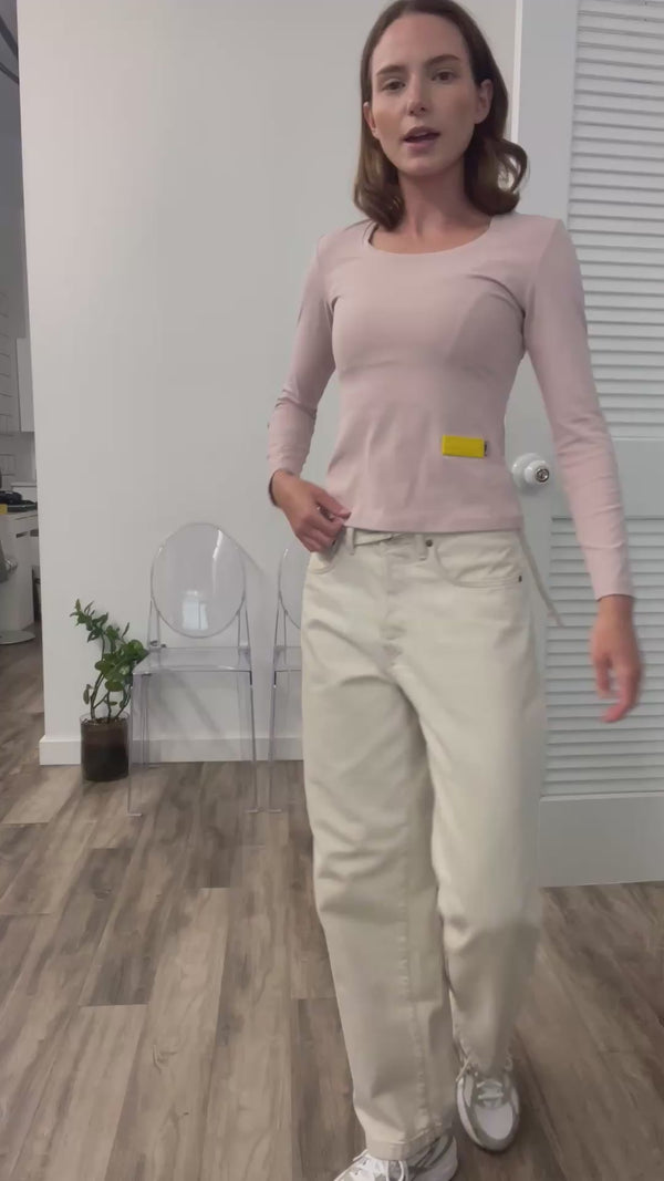 A video thumbnail showing the Lizzie top in motion to demonstrate its stretch, flexibility, and comfortable fit.