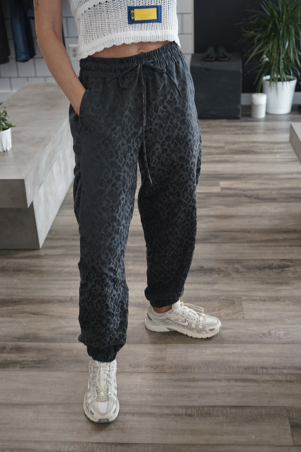 A thumbnail of a video demonstrating the gray animal print jogger pants by NINObrand
